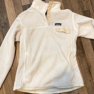White and cream Patagonia sweater with snaps